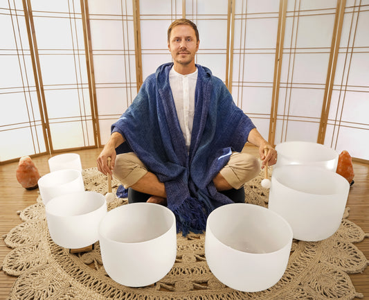 Travis with 7 chakra singing bowls