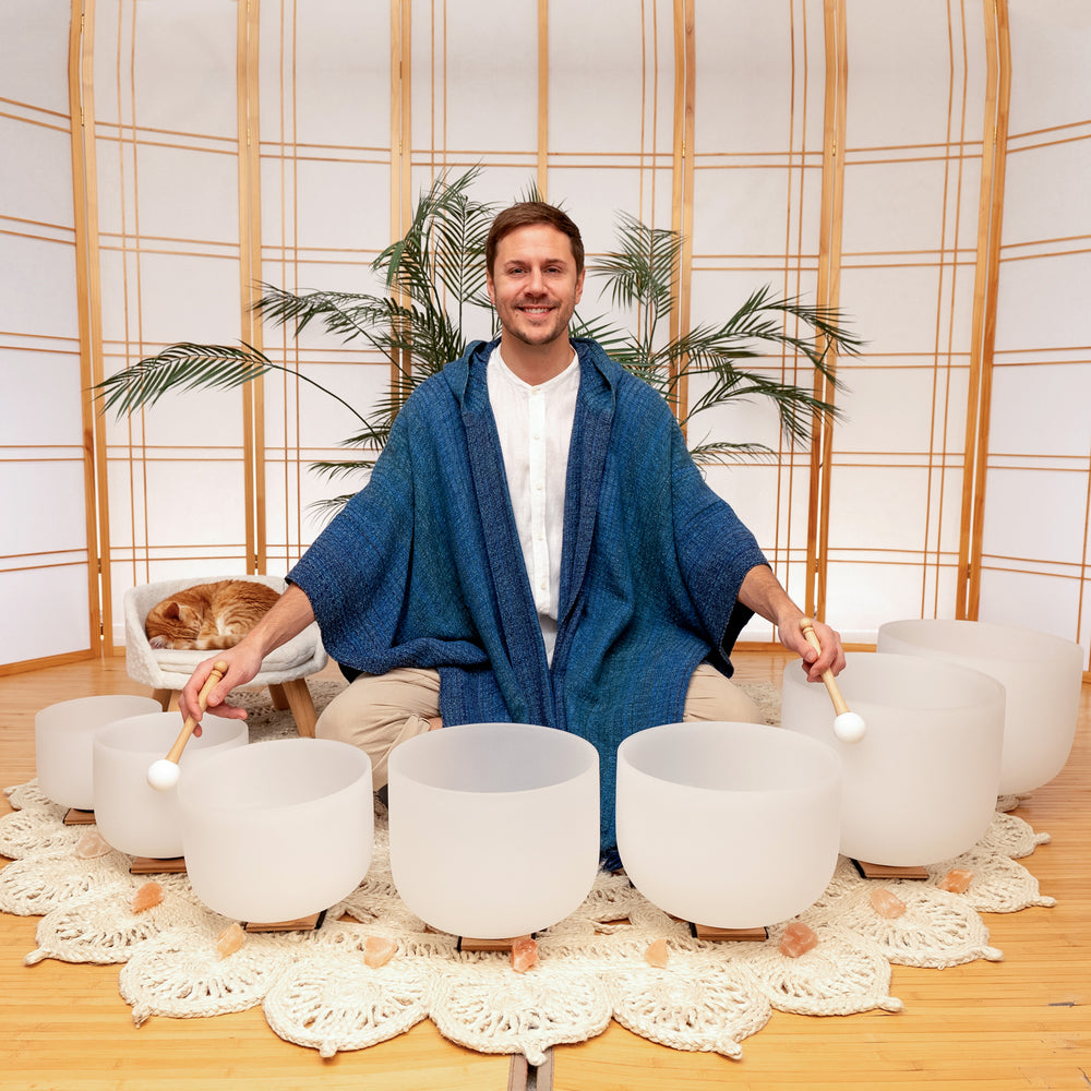 Travis with a complete set of crystal singing bowls